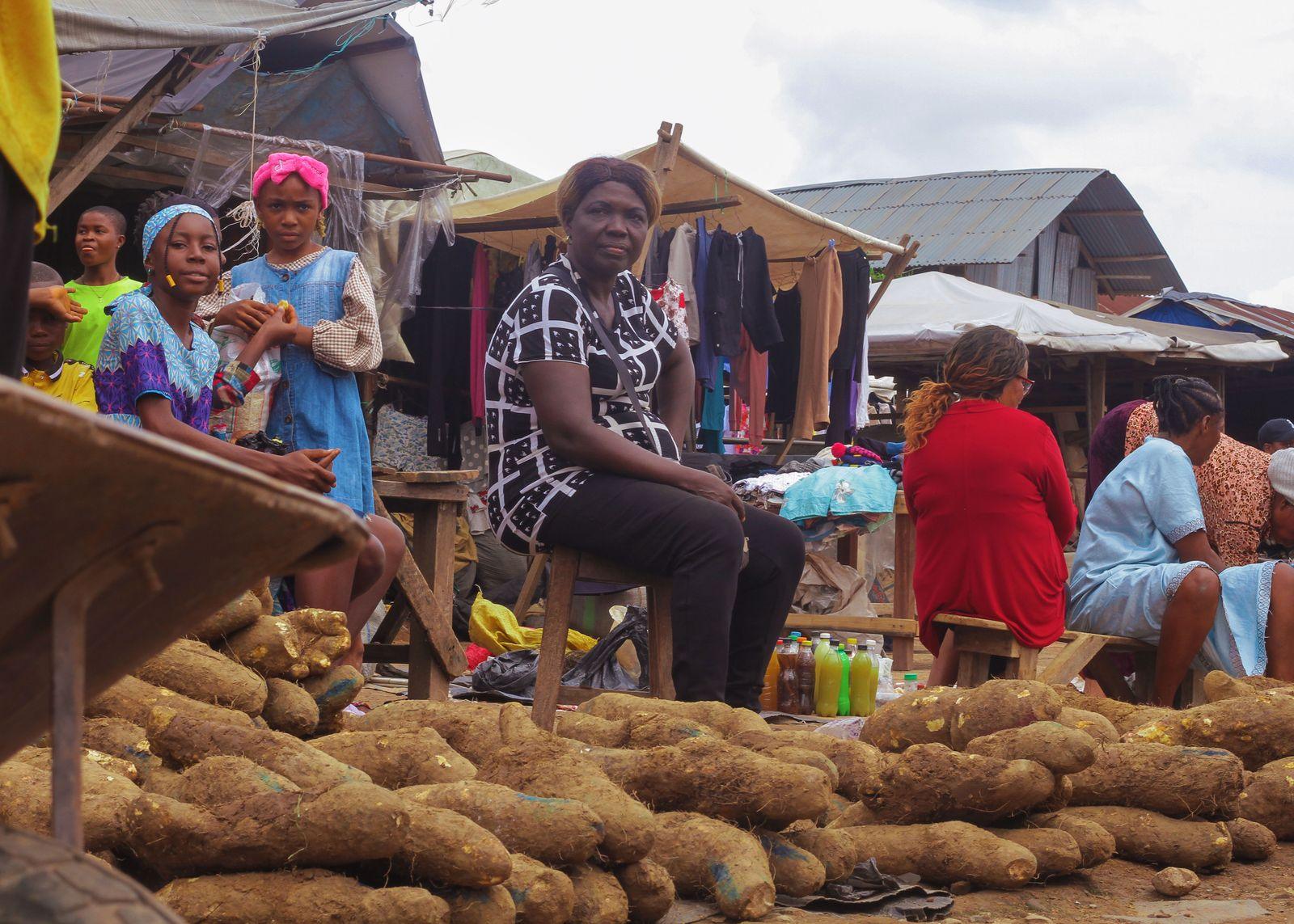Women traders selling produce at a busy local market